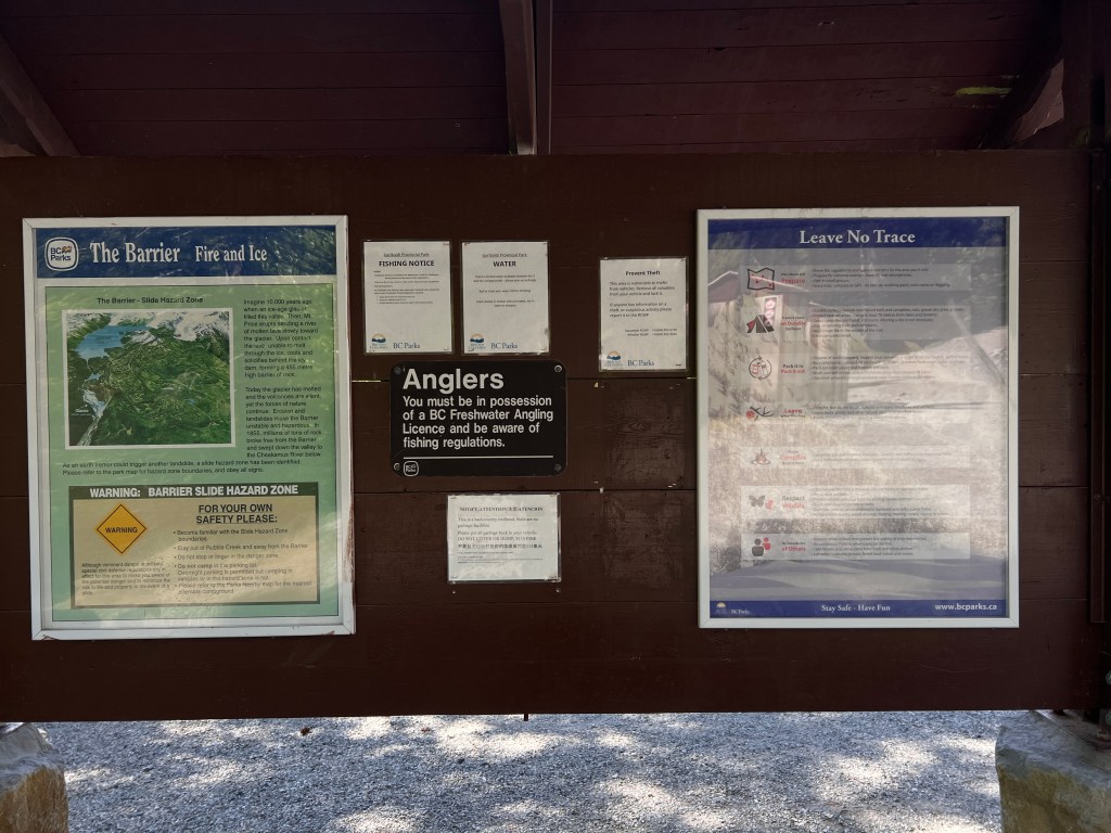 Rubble Creek trailhead parking lot for Garibaldi Lake hike in May showing a trail map board