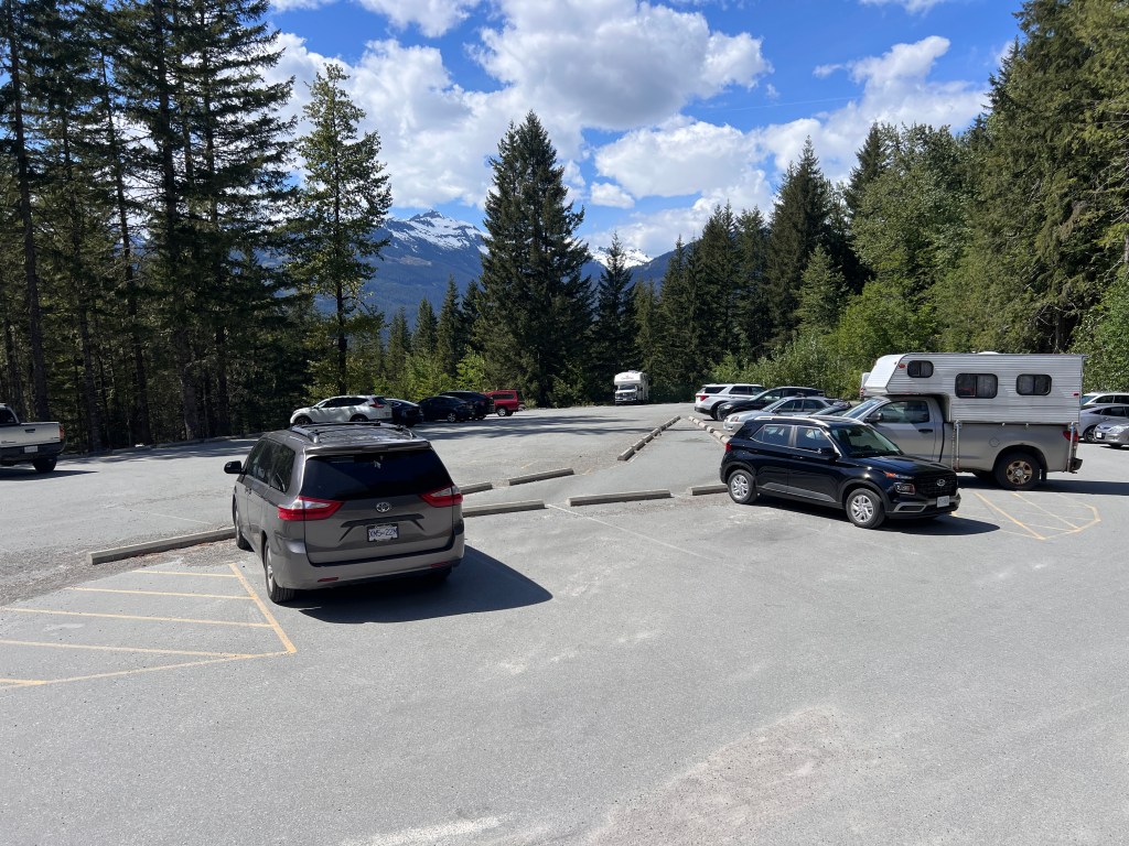Rubble Creek trailhead parking lot for Garibaldi Lake hike in May showing car spaces