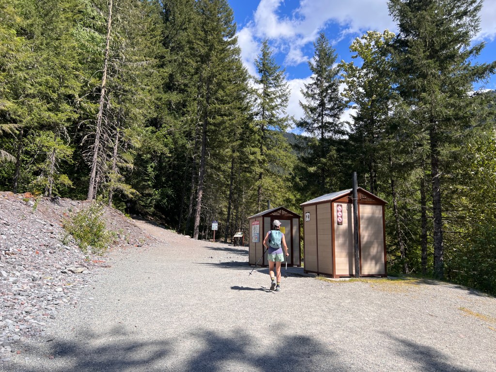 Rubble Creek trailhead parking lot for Garibaldi Lake hike in May showing two washrooms