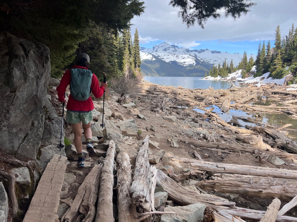 Garibaldi Lake landscape view looking out across the turquoise mountain water from the trail end