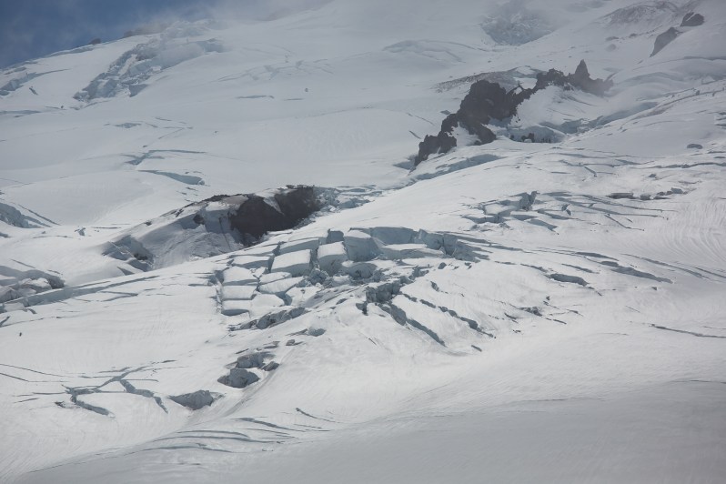 Massive active crevasses and alpine ice falls running down the slopes of Emmons Glacier on Mount Rainier